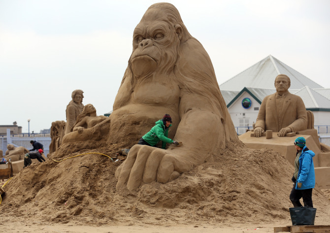 Sculptors Place The Finishing Touches To Their Hollywood Themed Sand Sculptures